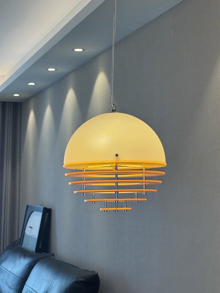 Real review image of the pendant lamp by a sofa