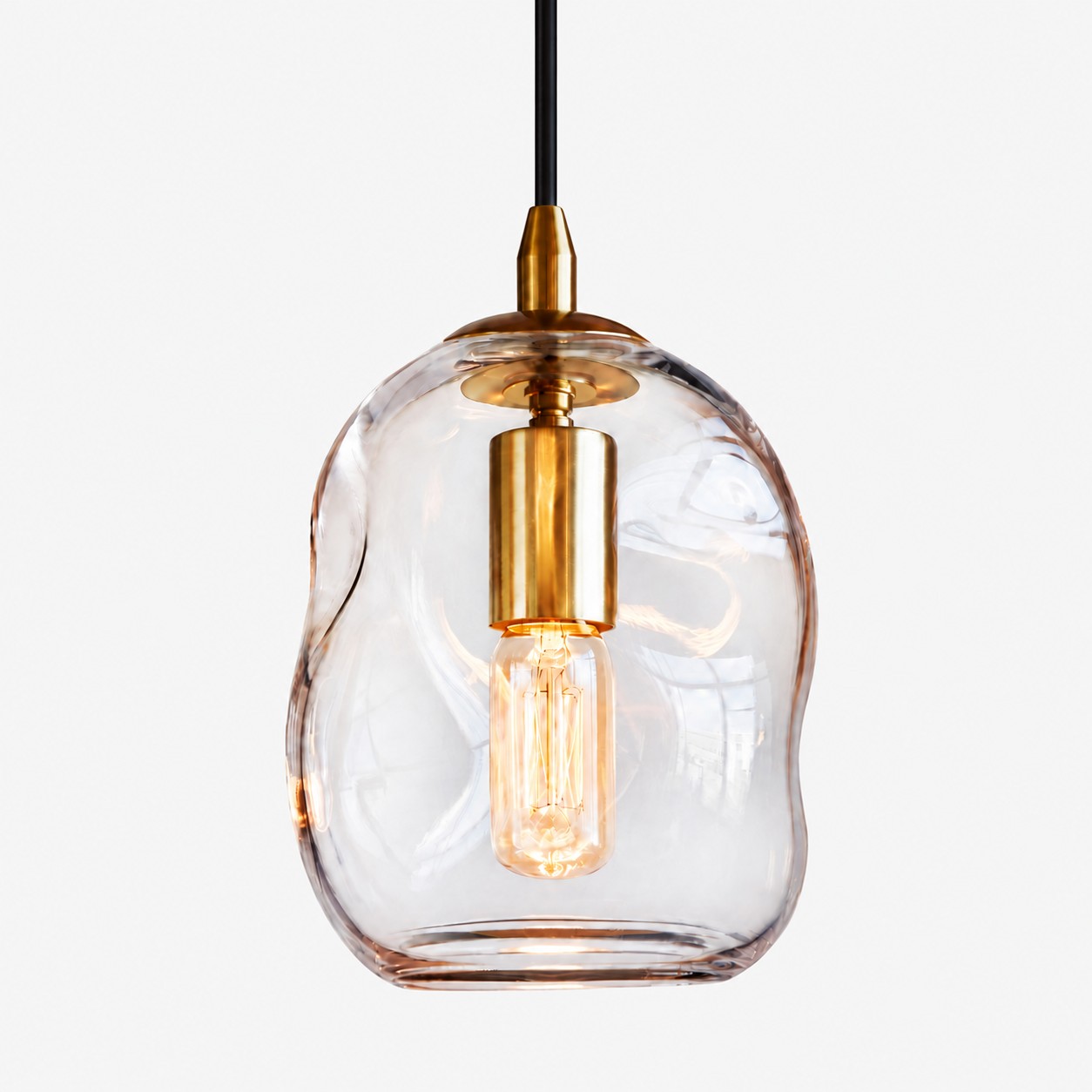 Hand-Blown Glass Globe Pendant — Brass-Finish Canopy — An understated perspective