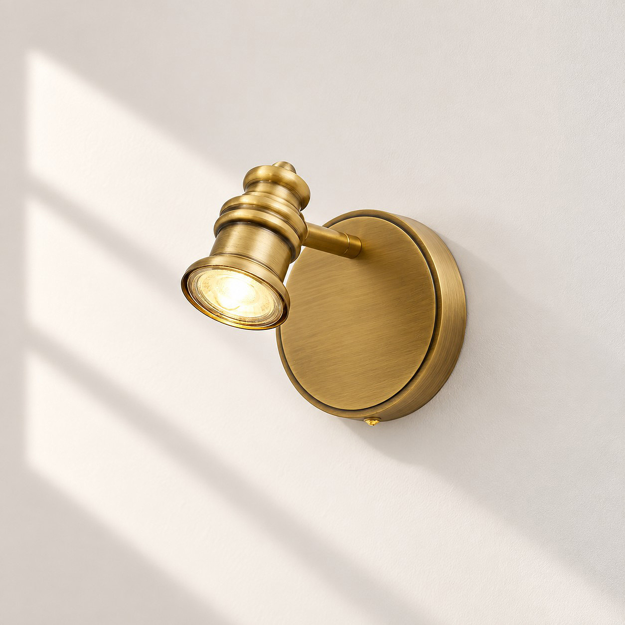 Sculpted Heads — Aurelia Adjustable Natural Brass Wall Light — An understated perspective
