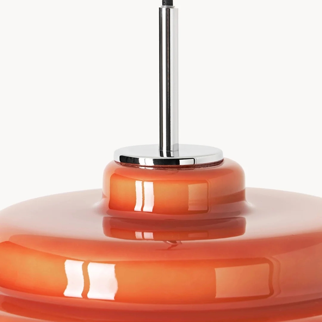 Chrome stem and orange glass shade detail