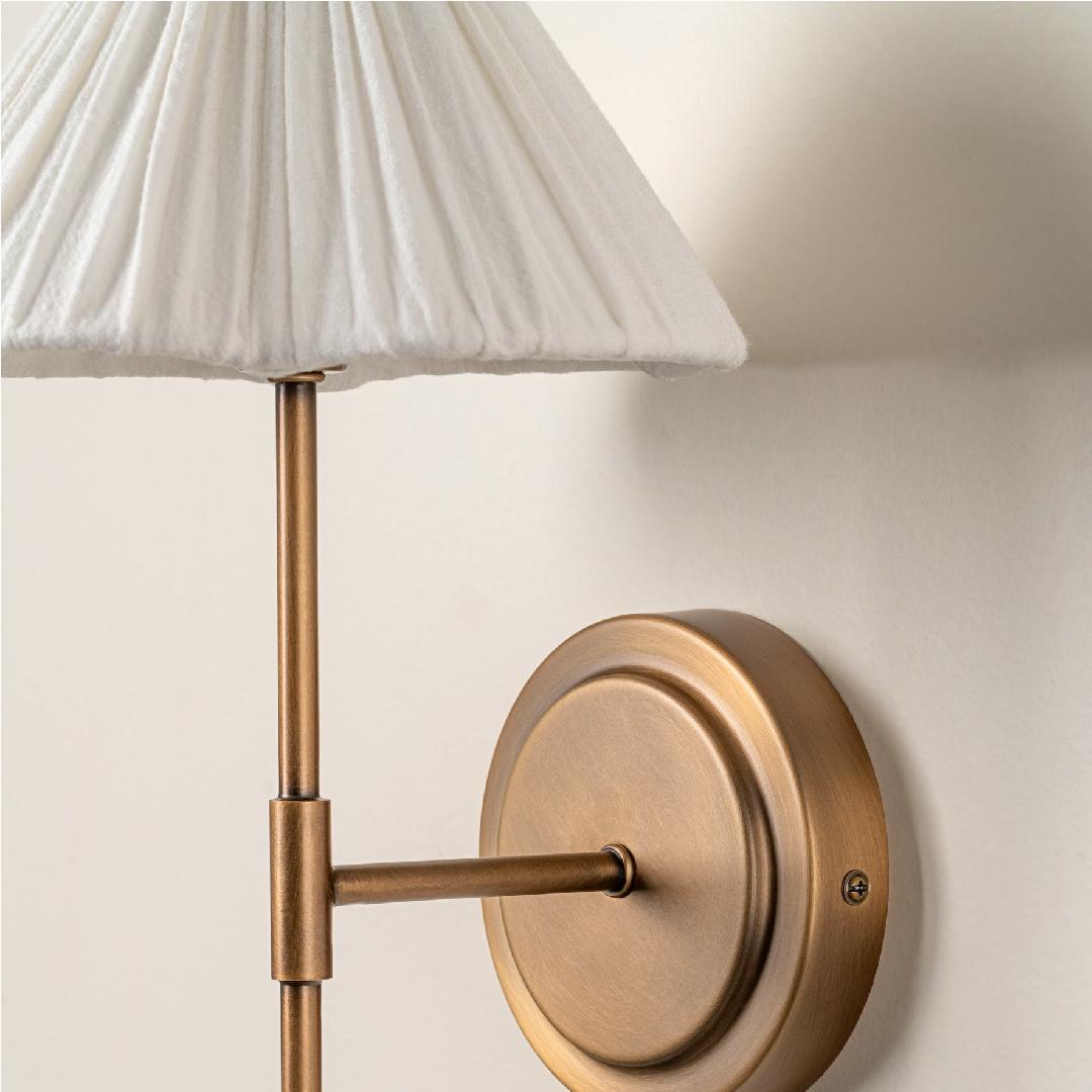 Lindi wall light linen shade and antique brass detail