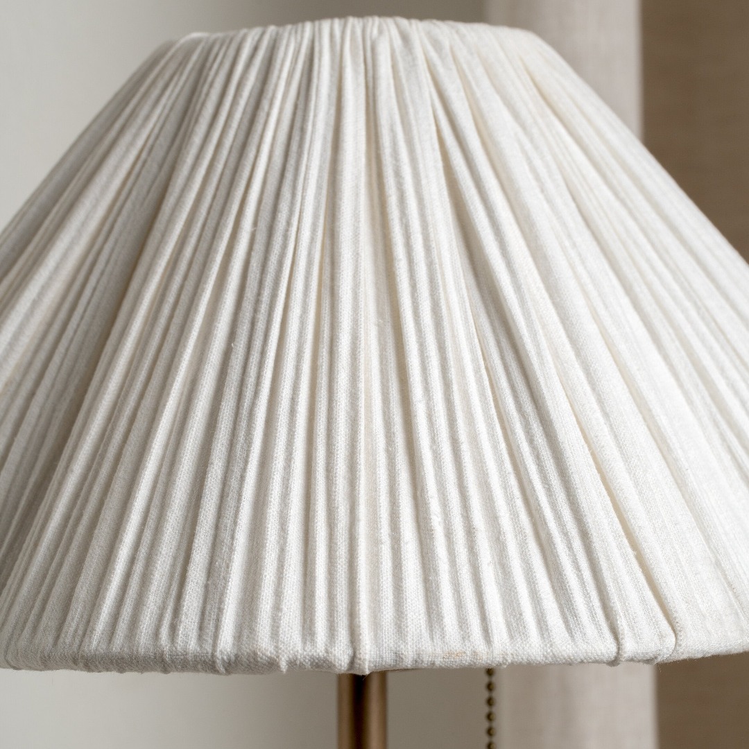 Close view of the scalloped linen shade