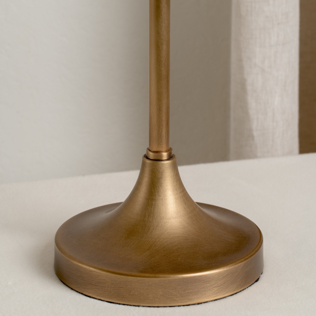 Close view of the aged brass lamp base
