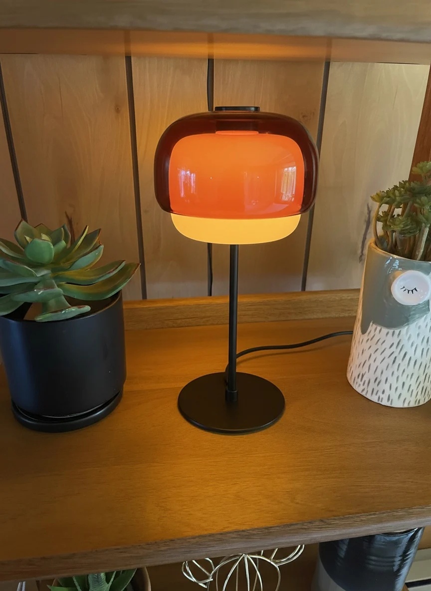 Customer photo of amber Clinco table lamp glowing