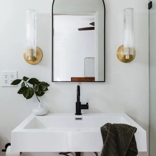 Customer vanity mirror installation with Rivora sconces