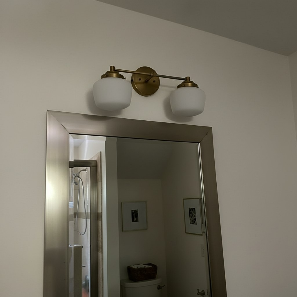 Customer photo of Opalume wall sconce above mirror
