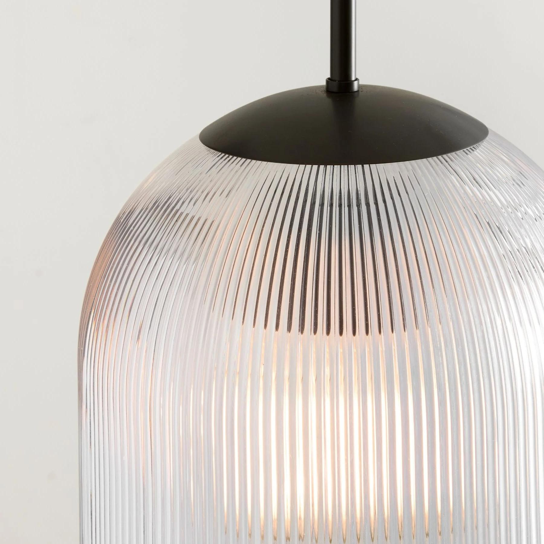 Illuminated ribbed glass pendant shade