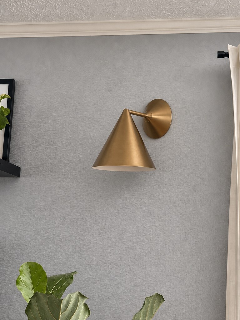 Customer photo of champagne Brivana wall lamp on gray wall