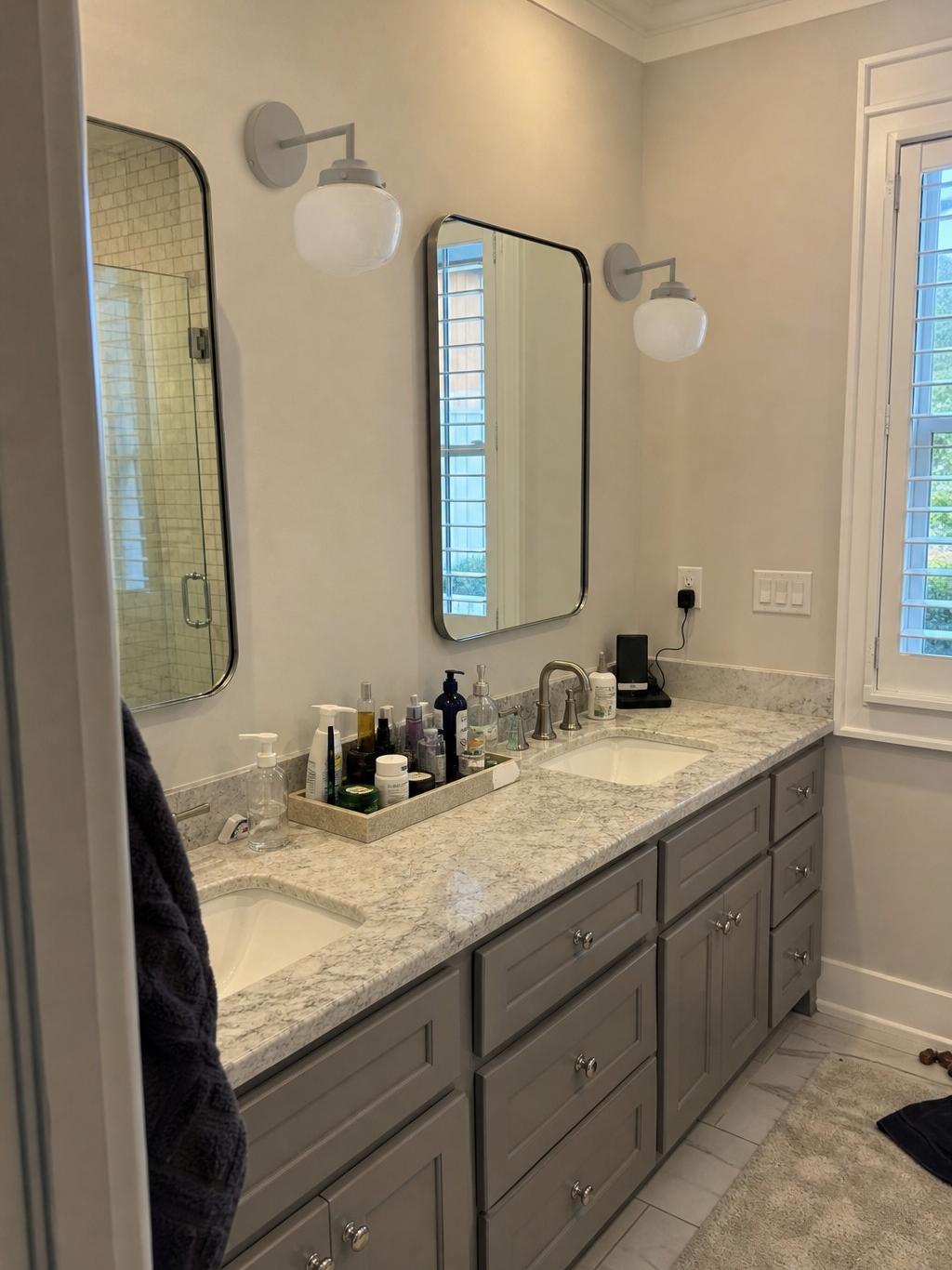 Customer vanity installation photo of Opalume wall sconce