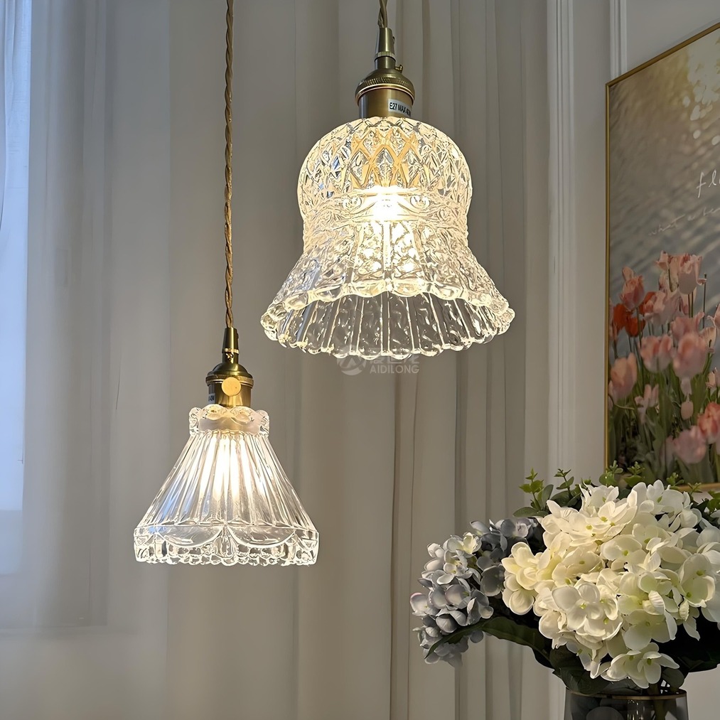 Two hanging pendant lights with flowers and wall art