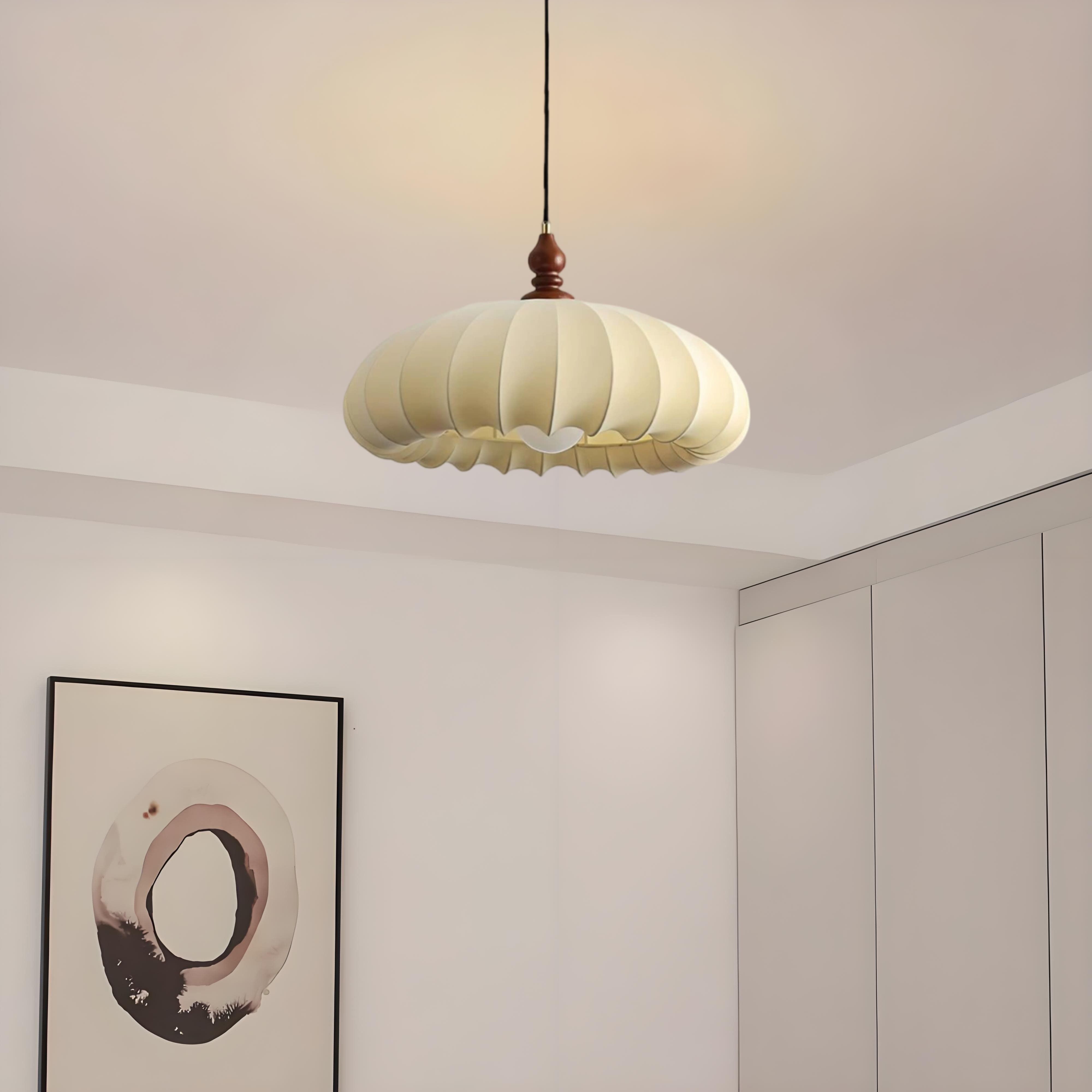 Pleated pendant light installed in a neutral interior