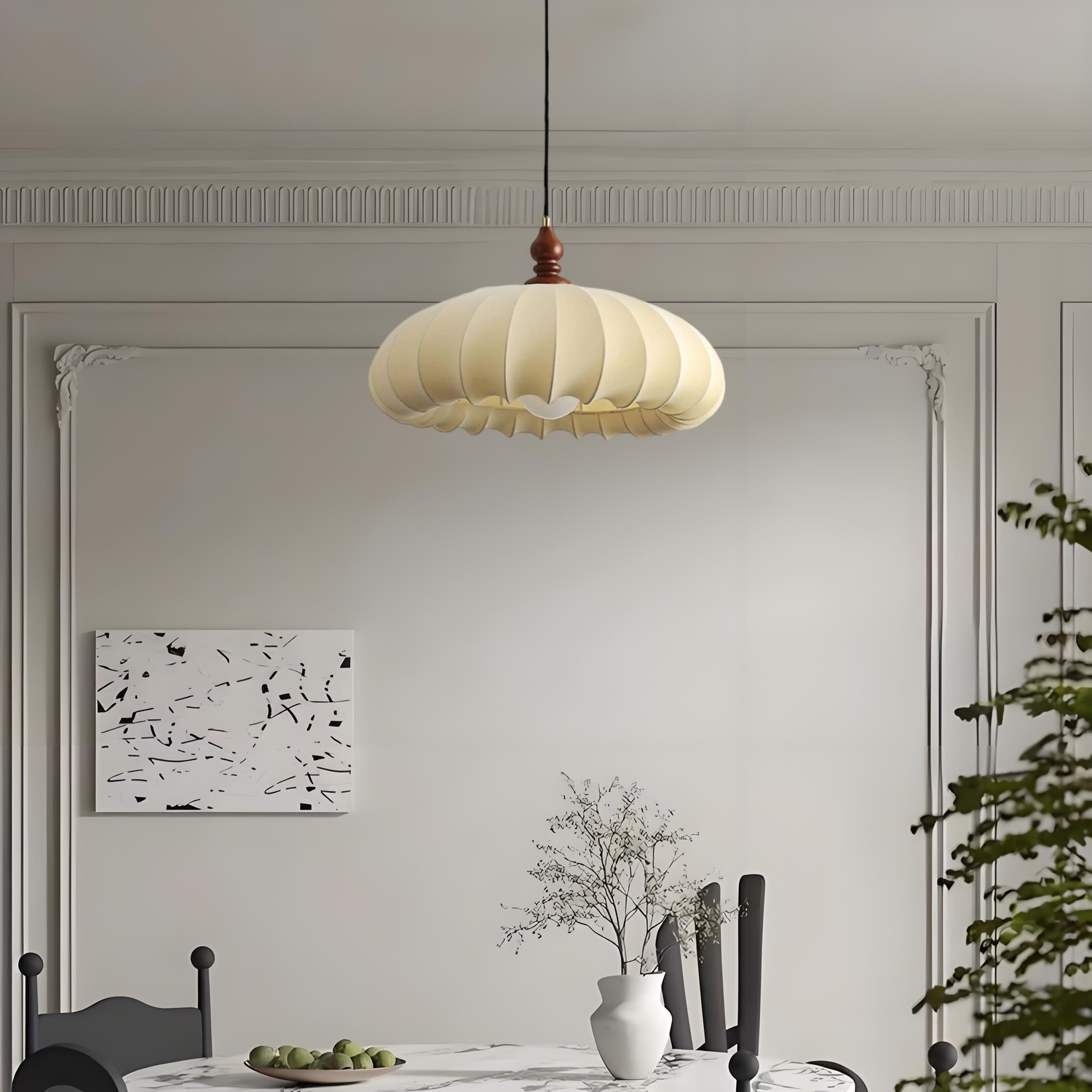 Wood accent pleated pendant light above a dining and work area