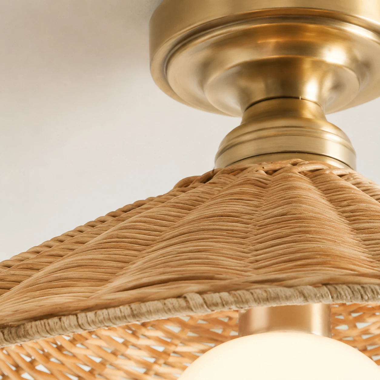 Close view of woven rattan texture and ceiling light craftsmanship