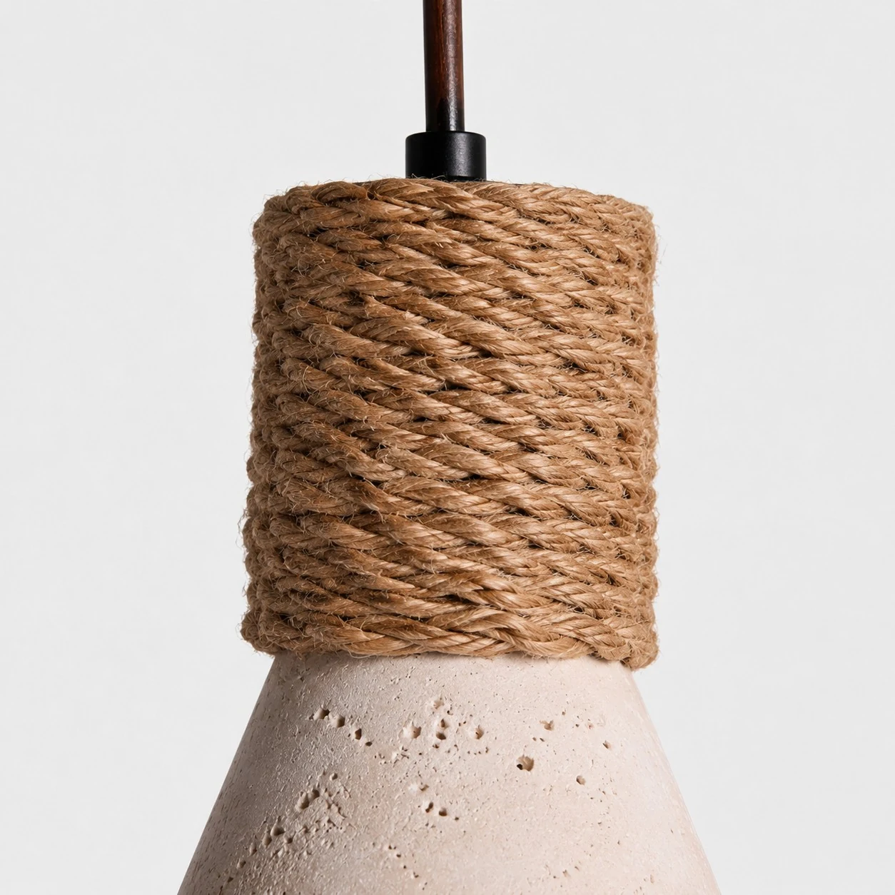 Close-up of woven rope texture and natural travertine pendant shade