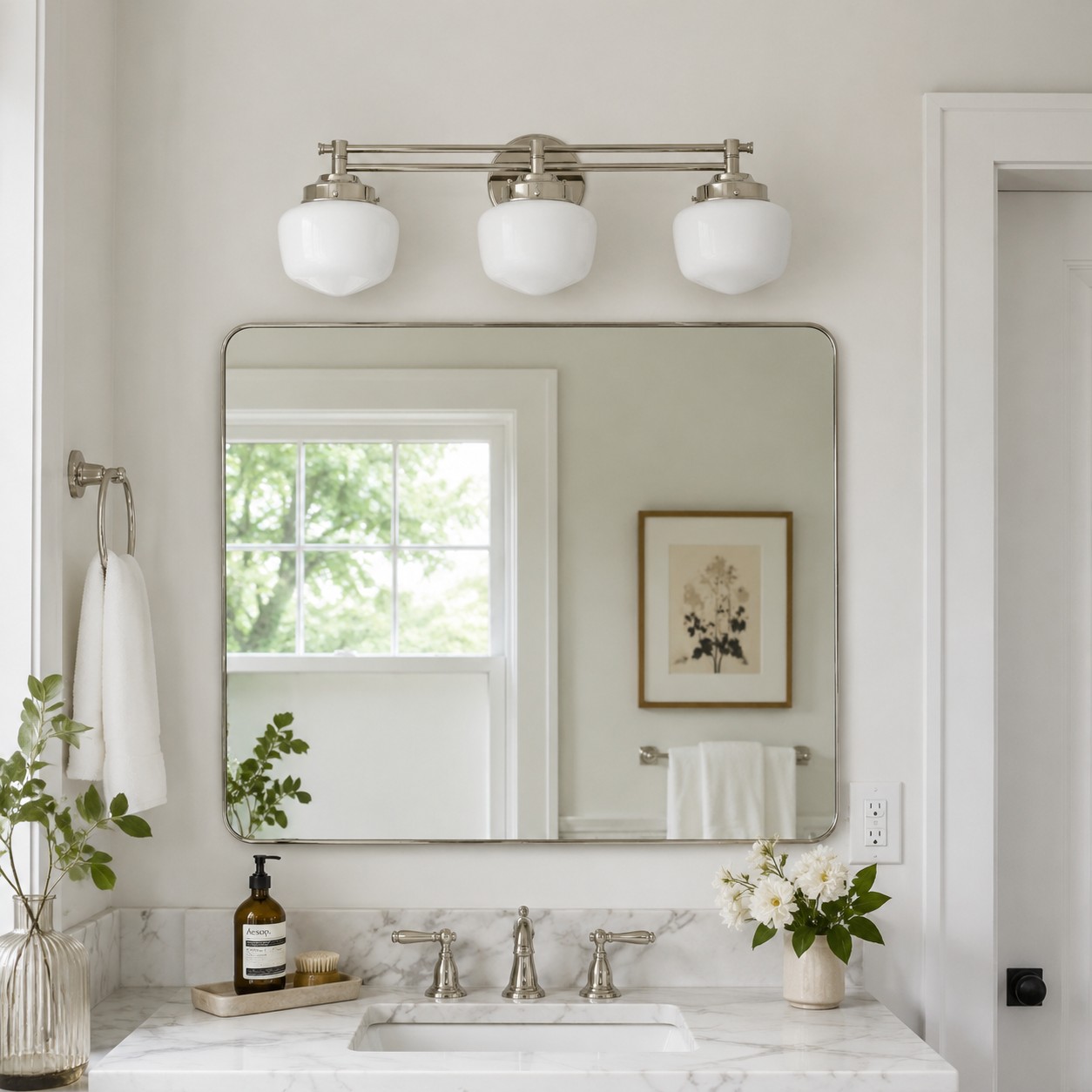 Three light Opalume vanity sconce above bathroom mirror