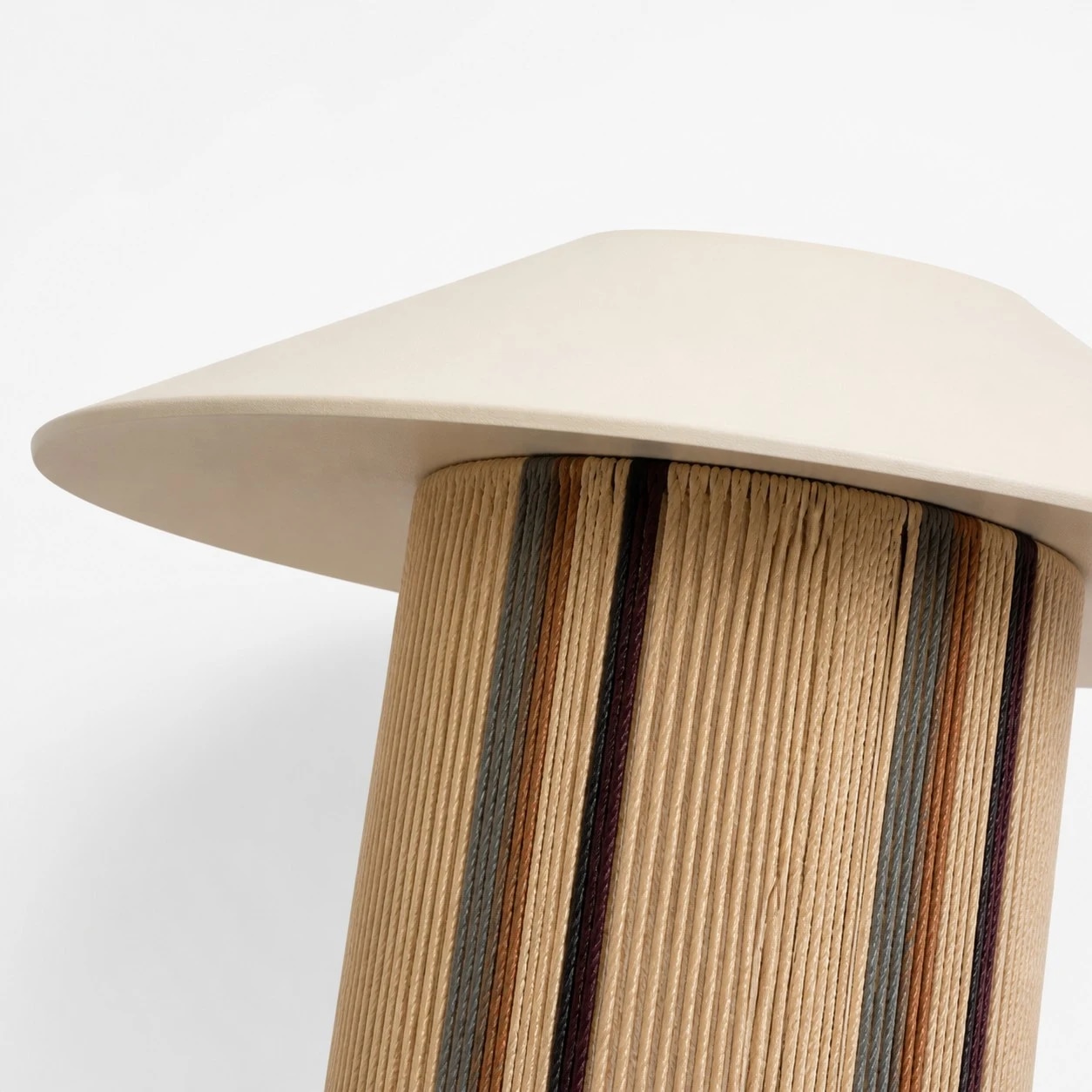Close-up of the pleated fabric shade and woven wall sconce texture