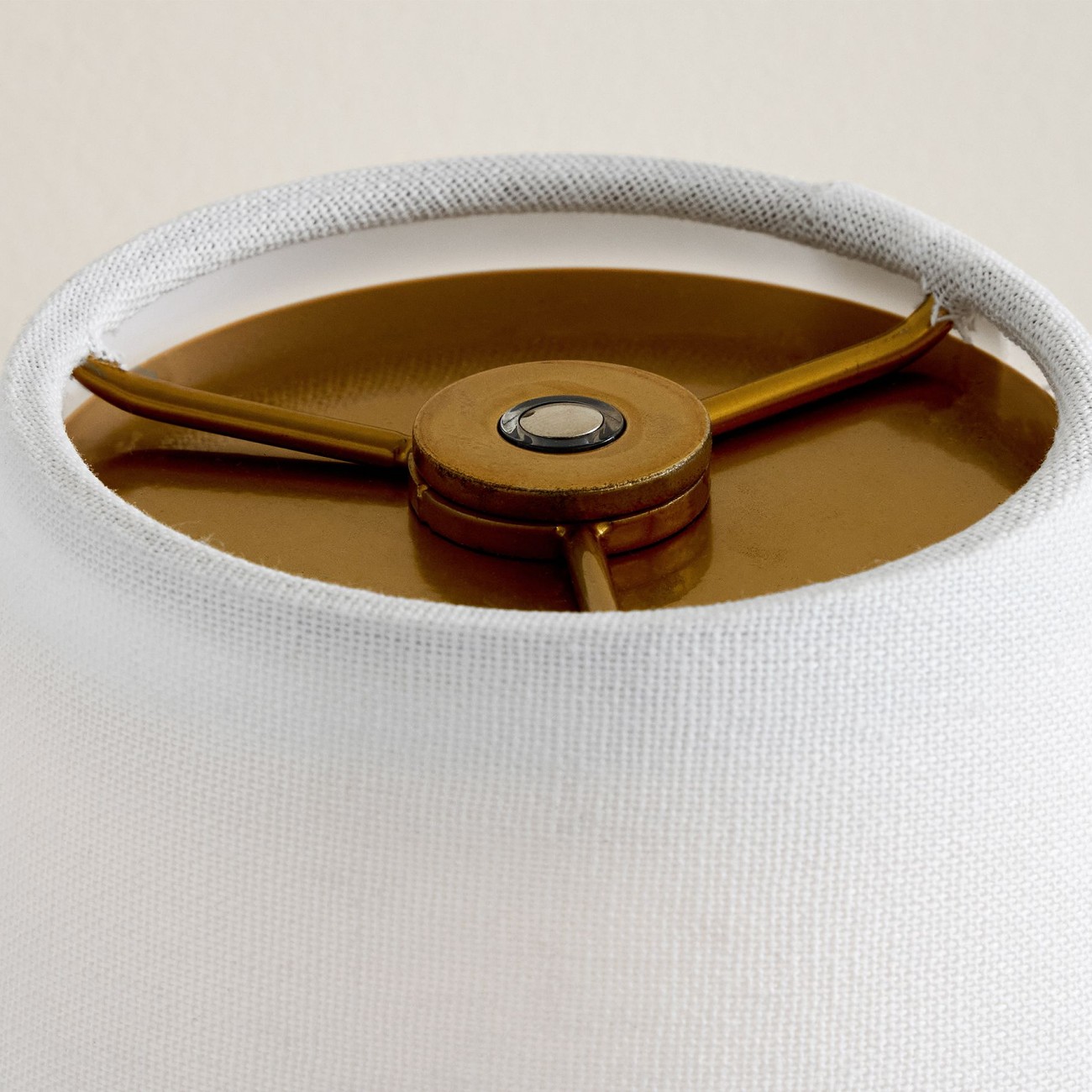 Close-up of the top control and rechargeable light component of the scalloped wall sconce