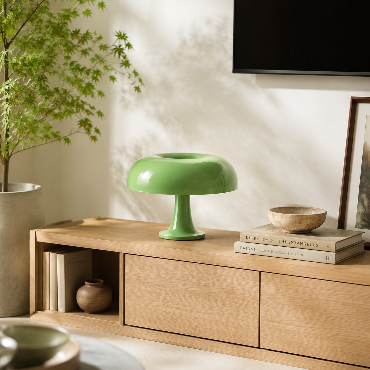 Apple green mushroom table lamp on a light wood media console
