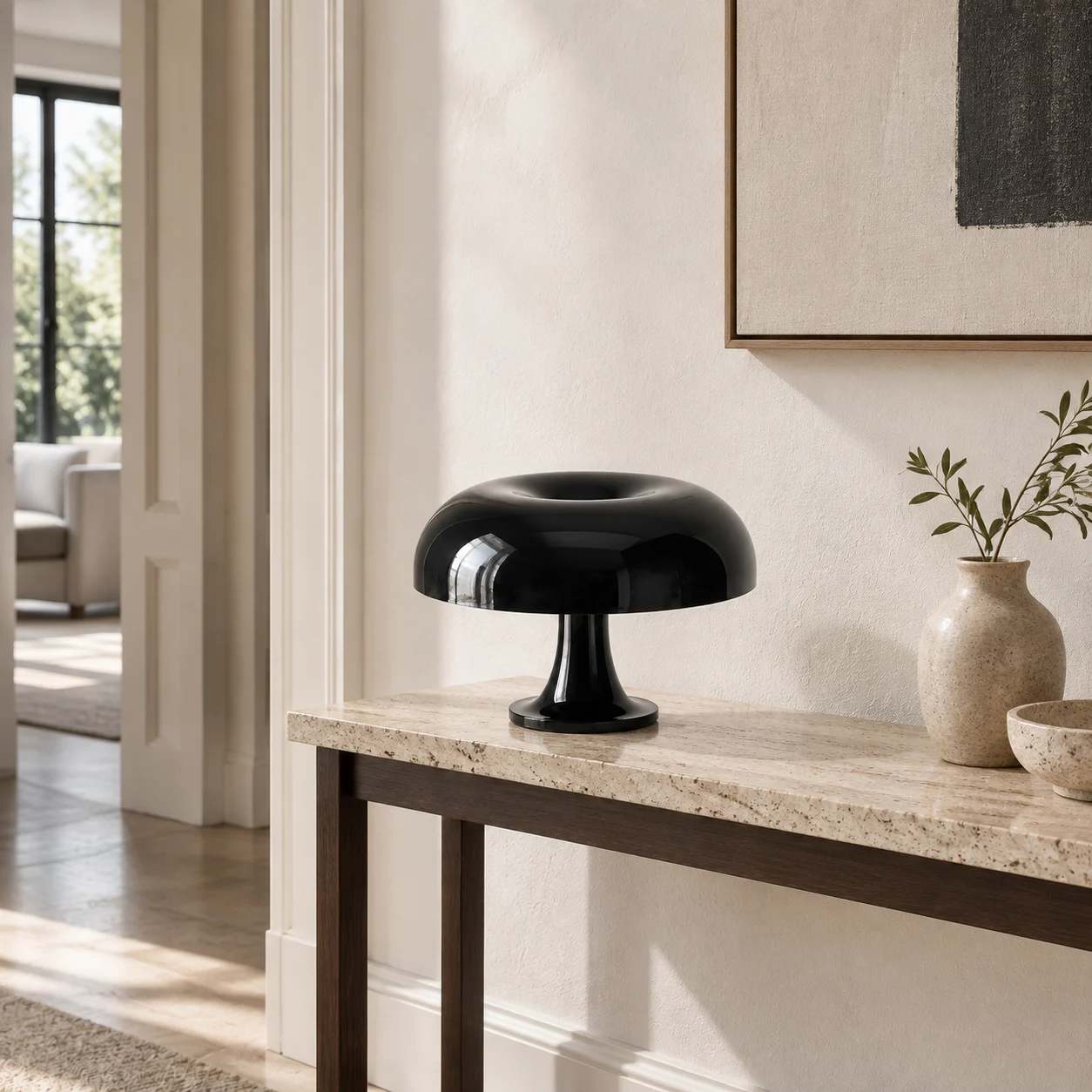 Black mushroom table lamp on a minimal stone entry console