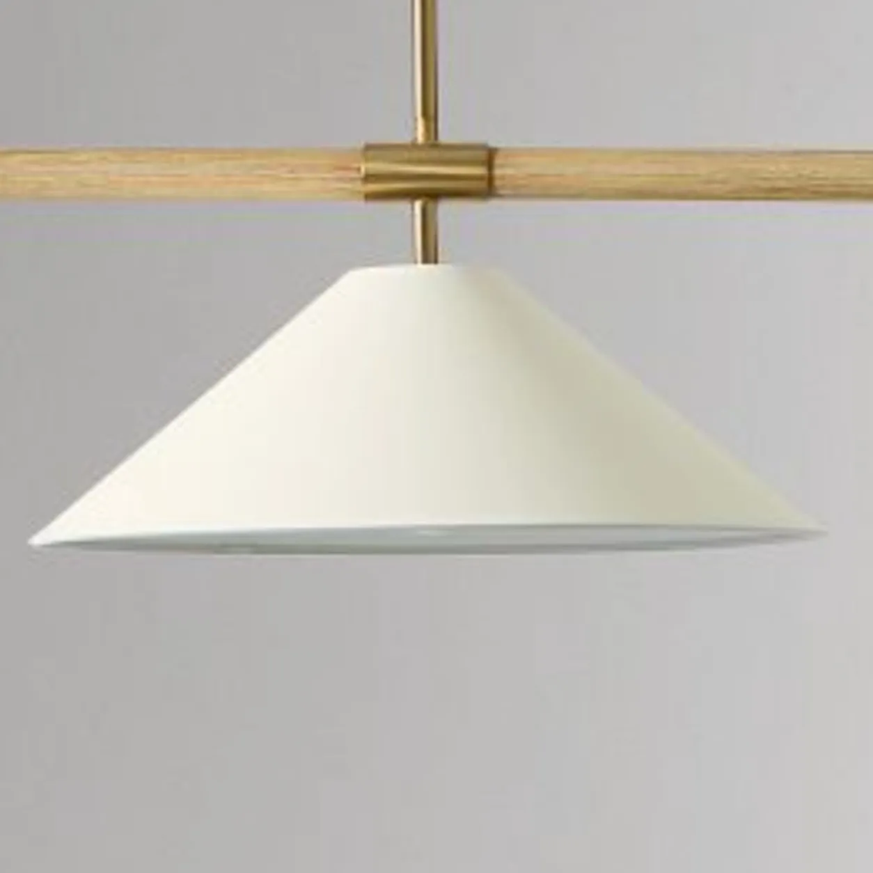 Close-up of the ivory parchment shade and brass rim