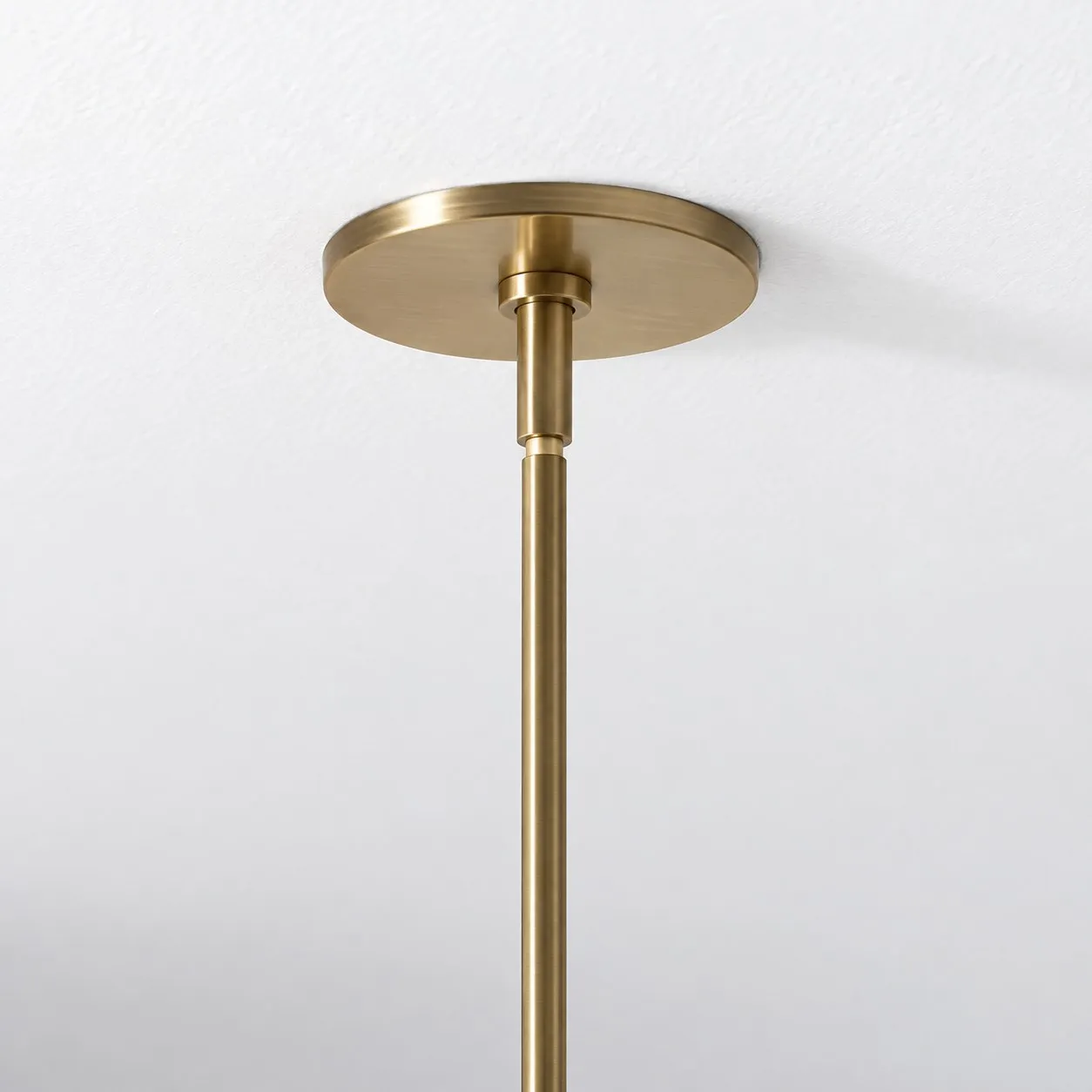 Close-up of the round antique brass ceiling canopy