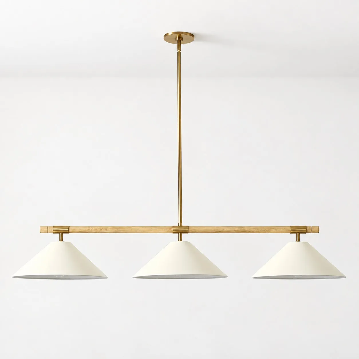 Devon linear chandelier installed on a white ceiling in daylight
