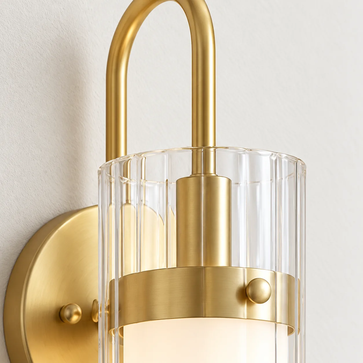 Close view of the soft gold arch and glass collar