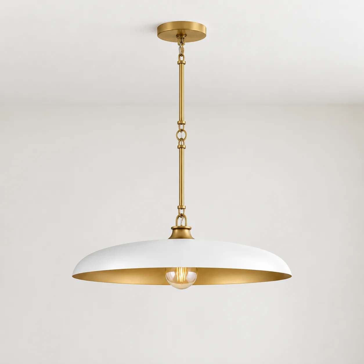 White disc metal pendant mounted on a ceiling in daylight