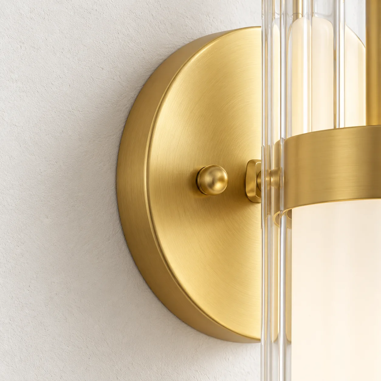 Close view of the circular soft gold backplate