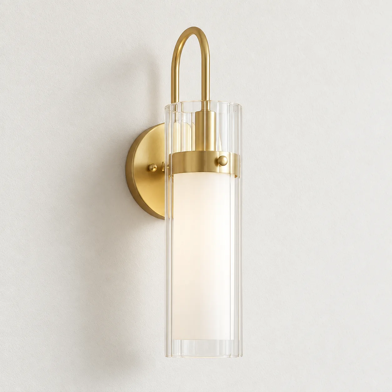 Anara soft gold fluted glass wall sconce mounted on a wall in daylight